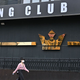 A woman walks by a night club in the Itaewon district in Seoul. The city closed all nightclubs and bars following a spike in new coronavirus infections linked to them.